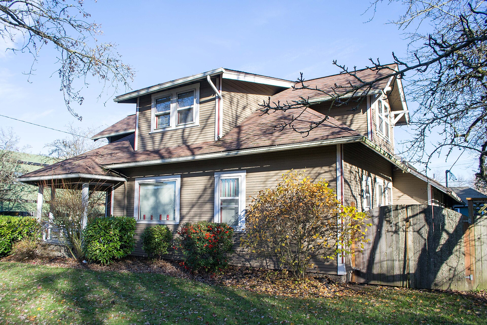 Craftsman-style house with a large shed dormer projecting from the roof above the main floor